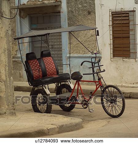 Stock Image - Pedicab parked on the street, Havana, Cuba. Fotosearch