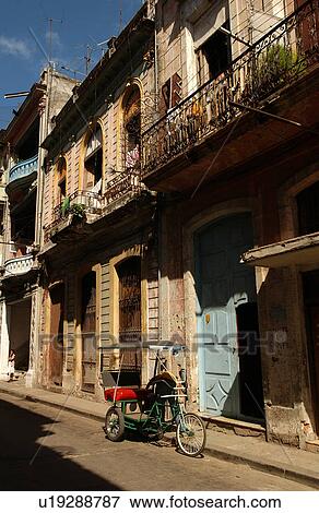 Pedicab parked outside a building, Havana, Cuba View Large Photo Image Stock Photo - Pedicab parked outside a building, Havana, Cuba. Fotosearch