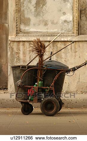 Stock Photograph - View of a cleaning cart parked on a street, Havana, Cuba. Fotosearch