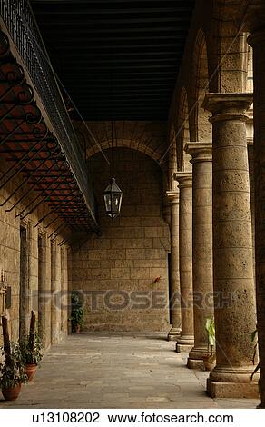 Columns lining a corridor of a building, Havana, Cuba View Large Photo Image Stock Image - Columns lining a corridor of a building, Havana, Cuba. Fotosearch