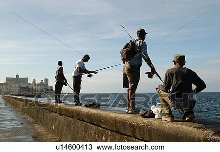 Group of people fishing on a pier, Havana, Cuba View Large Photo Image Stock Image - Group of people fishing on a pier, Havana, Cuba. Fotosearch