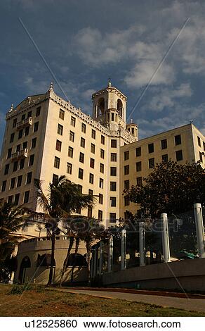 Stock Image - Low angle view of a commercial skyscraper, Havana, Cuba. Fotosearch