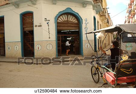 Pedicab parked front of a building structure, Havana, Cuba View Large Photo Image Picture - Pedicab parked front of a building structure, Havana, Cuba. Fotosearch