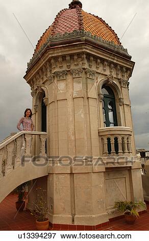 Portrait of a woman standing on the steps of an ornate complex, Havana, Cuba View Large Photo Image Stock Photo - Portrait of a woman standing on the steps of an ornate complex, Havana, Cuba. Fotosearch