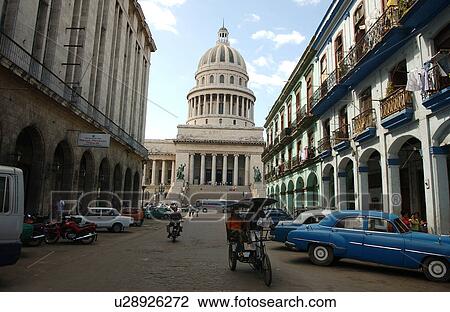 Stock Image - Street, rickshaw, capitol building in backround. Fotosearch