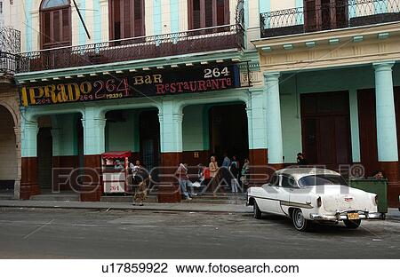 View of a group of people standing outside a restaurant, Havana, Cuba View Large Photo Image Stock Image - View of a group of people standing outside a restaurant, Havana, Cuba. Fotosearch