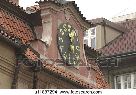 Picture - Clock on a Jewish establishment in Prague. Fotosearch