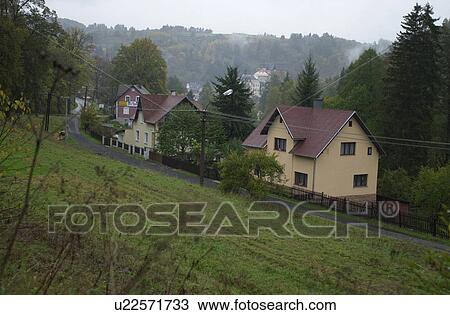 Houses near a green hill in Prague View Large Photo Image Stock Image - Houses near a green hill in Prague. Fotosearch