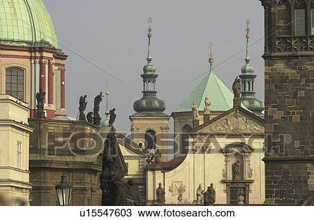 Roof tops and steeples of ancient buildings in Prague View Large Photo Image Stock Image - Roof tops and steeples of ancient buildings in Prague. Fotosearch