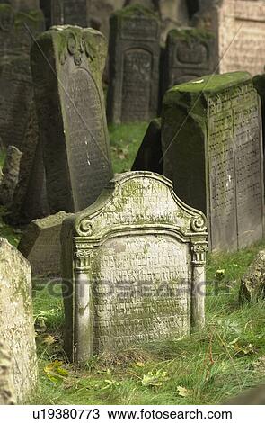 Stock Image - Tomb stones at a Jewish establishment in Prague. Fotosearch