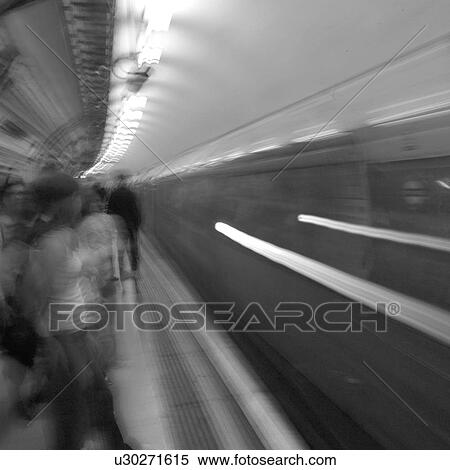 Stock Photography - Train passing in an underground subway station in London, England. Fotosearch