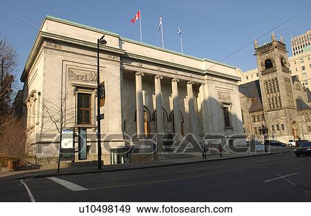 Stock Photo - Building with flags on the roof in Montreal, Canada. Fotosearch