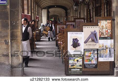 Waiter standing at a restaurant in Paris, France View Large Photo Image Stock Image - Waiter standing at a restaurant in Paris, France. Fotosearch
