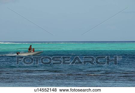 Panoramic view of people on a boat in the sea, Moorea, Tahiti, French Polynesia, South Pacific View Large Photo Image Stock Photo - Panoramic view of people on a boat in the sea, Moorea, Tahiti, French Polynesia, South Pacific. Fotosearch