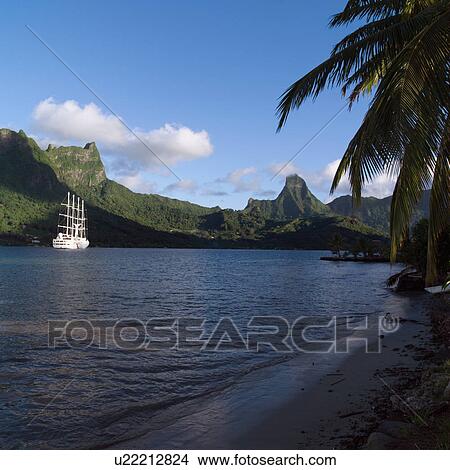 Picture - White Ship near Shore at Moorea in Tahiti. Fotosearch