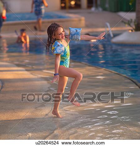 Young girl skipping in water View Large Photo Image Picture - Young girl skipping in water. Fotosearch