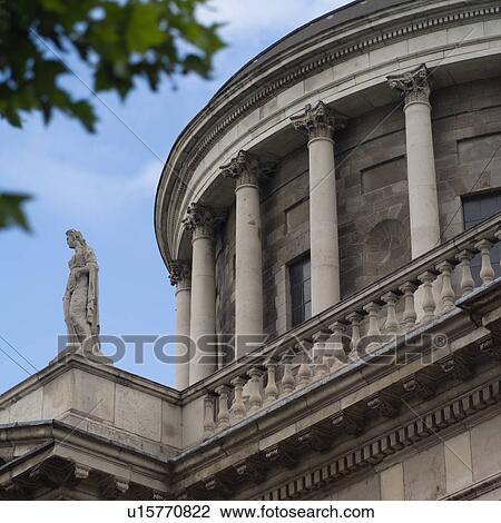 Dublin, Ireland - Statue and façade of Four Courts View Large Photo Image Stock Image - Dublin, Ireland - Statue and façade of Four Courts. Fotosearch