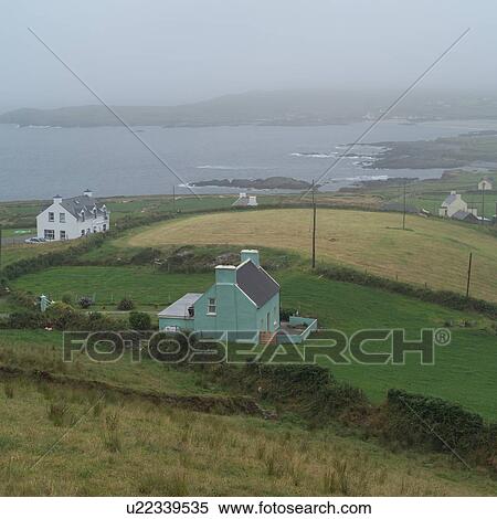 Stock Photography - Ireland - countryside buildings by the sea. Fotosearch