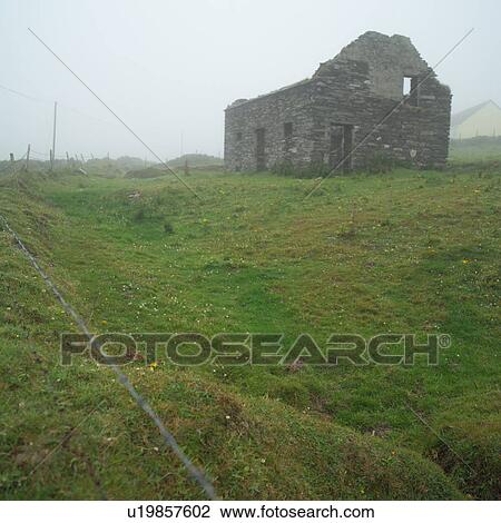 Stock Image - Ireland - countryside house in ruins. Fotosearch