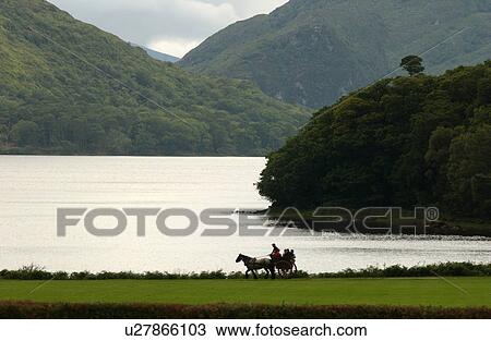 Stock Image - Ireland - Killarney - horse and cart by lake. Fotosearch
