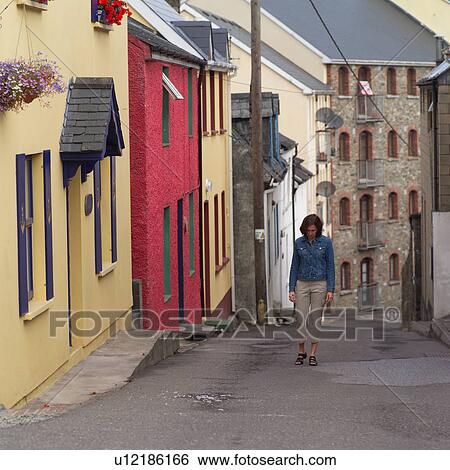 Ireland - Kinsale - Woman walking View Large Photo Image Stock Photograph - Ireland - Kinsale - Woman walking. Fotosearch