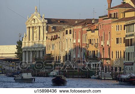 Stock Photograph - Buildings on the banks of a canal in Venice, Italy. Fotosearch