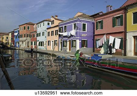 An array of colorful residential buildings along a canal in Venice, Burano, Italy View Large Photo Image Stock Image - An array of colorful residential buildings along a canal in Venice, Burano, Italy. Fotosearch
