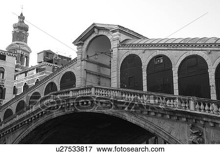 Arched bridge over a canal in Venice, Italy View Large Photo Image Stock Photo - Arched bridge over a canal in Venice, Italy. Fotosearch