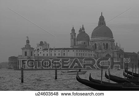 Stock Photo - Array of gondolas docked at a canal in Venice, Italy. Fotosearch