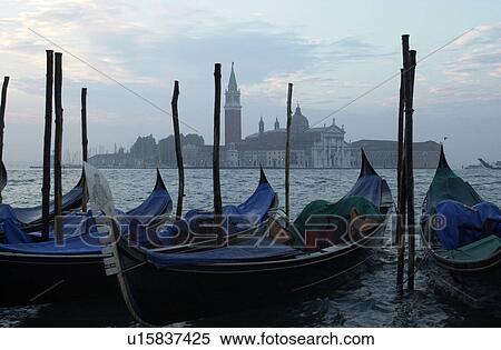 Stock Photography - Array of gondolas docked at a canal in Venice, Italy. Fotosearch