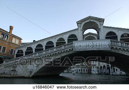 Stock Photo - Bridge spanning over a canal in Venice, Italy. Fotosearch