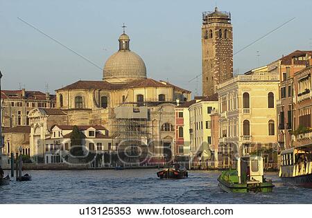 Stock Image - Buildings on the banks of a canal in Venice, Italy. Fotosearch