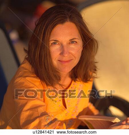 Brunette woman looking at the camera View Large Photo Image Stock Image - Brunette woman looking at the camera. Fotosearch