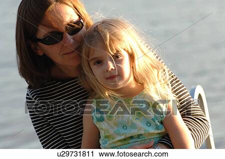 Mother holding child View Large Photo Image Stock Image - Mother holding child. Fotosearch