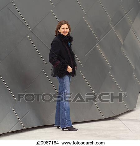 Picture - Portrait of a young woman smiling at Millennium Park. Fotosearch
