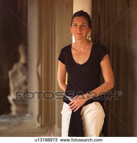 Woman at Khmer Kingdom palace ruins View Large Photo Image Stock Image - Woman at Khmer Kingdom palace ruins. Fotosearch