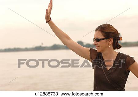 Woman waving View Large Photo Image Stock Image - Woman waving. Fotosearch
