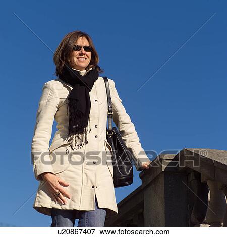 Stock Photo - Young women in winter coat. Fotosearch