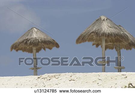 Beach umbrellas on a beach in Mexico View Large Photo Image Stock Photography - Beach umbrellas on a beach in Mexico. Fotosearch