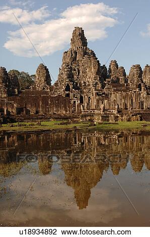 Exterior wall of Khmer Kingdom palace ruins reflected in pond View Large Photo Image Stock Image - Exterior wall of Khmer Kingdom palace ruins reflected in pond. Fotosearch