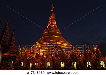 Stock Photo - Golden Stupa at night. Fotosearch