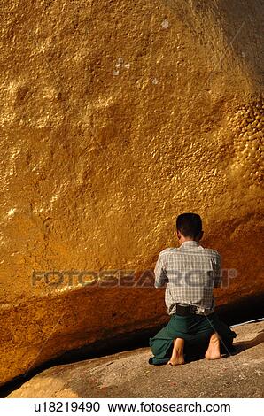 Man worshiping at Golden Rock View Large Photo Image Stock Image - Man worshiping at Golden Rock. Fotosearch
