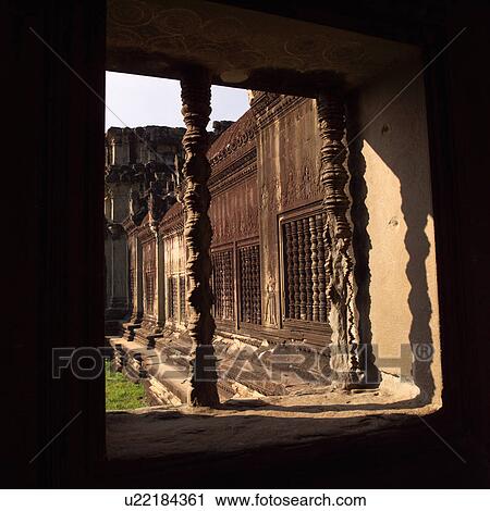 Stock Image - Opening through wall at the Khmer Kingdom palace ruins. Fotosearch