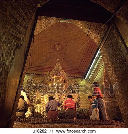 Pilgrims at a Buddhist temple in Mandalay View Large Photo Image Stock Image - Pilgrims at a Buddhist temple in Mandalay. Fotosearch
