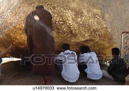 Worshippers in praying at Golden Rock View Large Photo Image Stock Image - Worshippers in praying at Golden Rock. Fotosearch