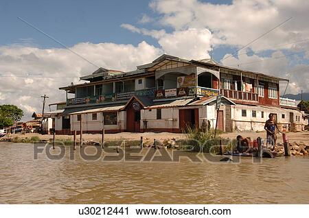 Stock Image - Building along shoreline of Inle Lake. Fotosearch