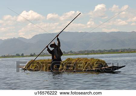 Farmers in row boat View Large Photo Image Stock Image - Farmers in row boat. Fotosearch