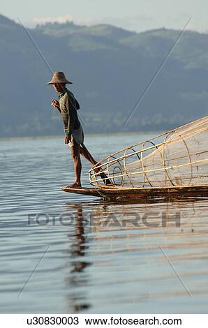 Fisherman in row boat View Large Photo Image Stock Image - Fisherman in row boat. Fotosearch
