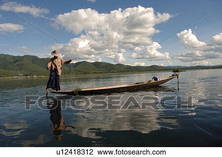 Stock Image - Fisherman leg rowing. Fotosearch