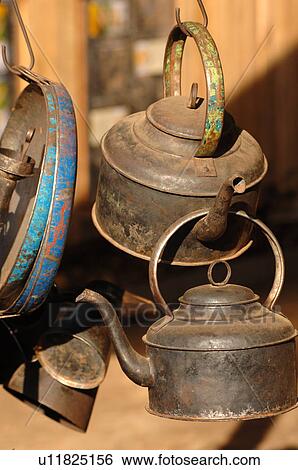 Hanging kettles View Large Photo Image Stock Photograph - Hanging kettles. Fotosearch